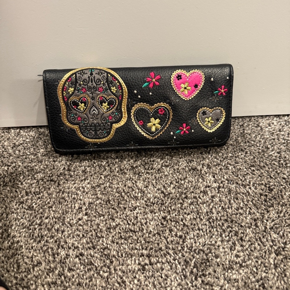 Loungefly tri-fold skull wallet.